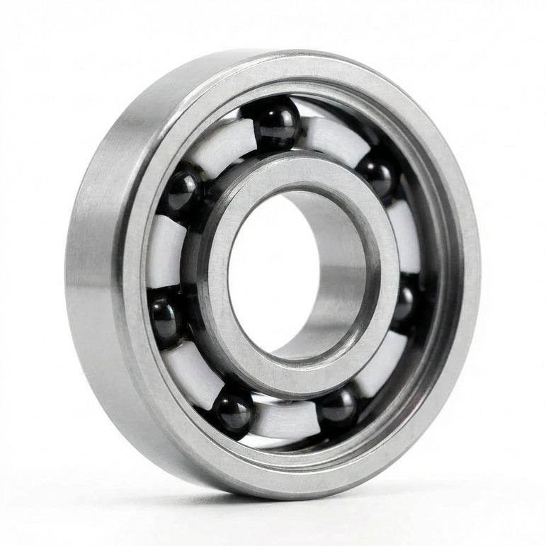 Apex Bearing with silver steel rings, black balls and a white cage, standing upright on a white background