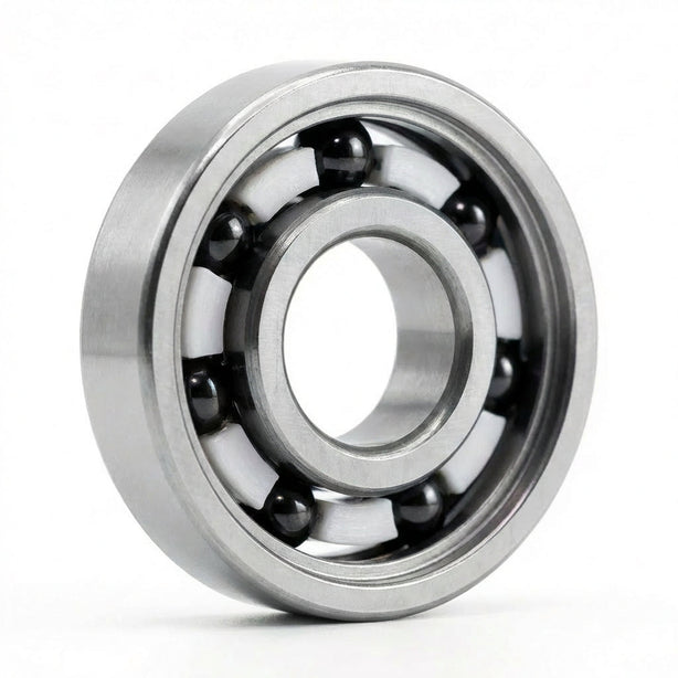 Apex Bearing with silver steel rings, black balls and a white cage, standing upright on a white background