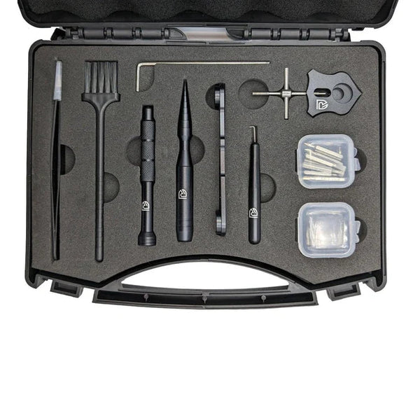 Baitcaster Reel Tool Kit in an open black case with tweezers, brush, hex key, black tools and two small parts boxes in foam