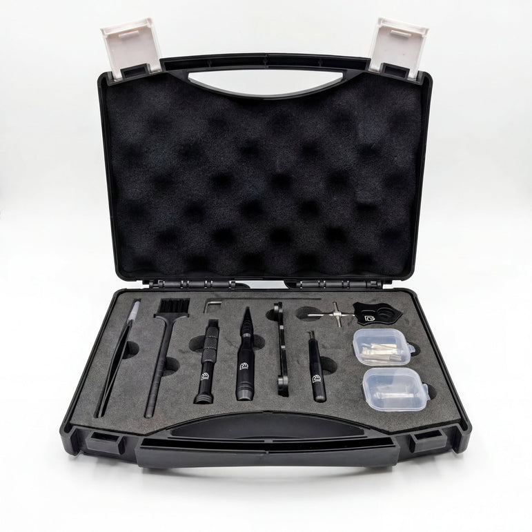 Baitcaster Reel Tool Kit open in a black foam-lined case with tweezers, a brush, black tools and two small clear parts boxes