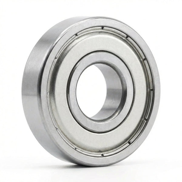 A Core Bearing with silver metal shields standing upright on its edge against a plain white background