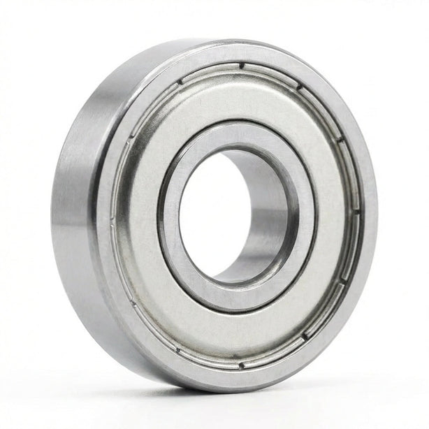A Core Bearing with silver metal shields standing upright on its edge against a plain white background