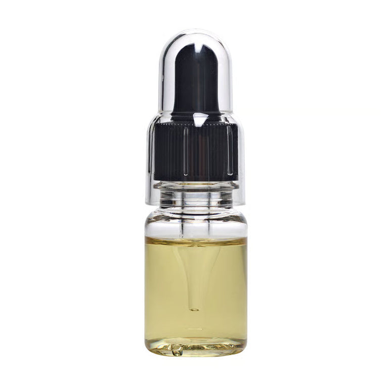 Glitch Oil Creep in a small clear dropper bottle with black cap and clear cover, filled with pale yellow oil, on white