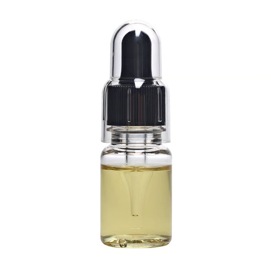 Glitch Oil Creep in a small clear dropper bottle with black cap and clear cover, filled with pale yellow oil, on white