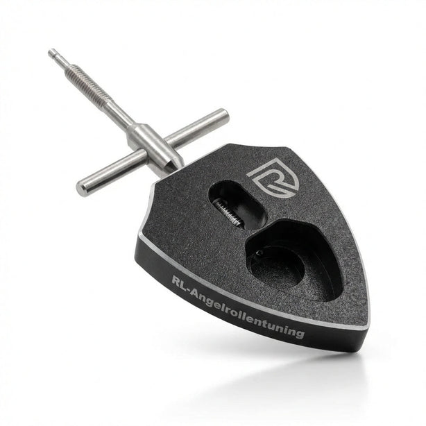 Spool Bearing Pin Remover with a black shield-shaped body and a steel T-handle threaded pin, on a white background